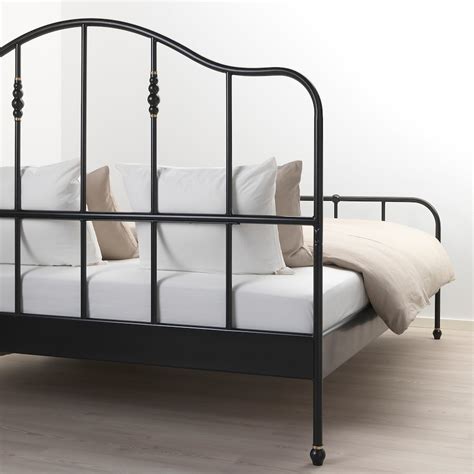 The open-<b>frame</b> headboard and footboard have rounded corners and feature vertical spindles with decorative castings. . Sagstua bed frame